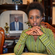 Rwanda presidential candidate Diane Rwigara next to a portrait of her father.